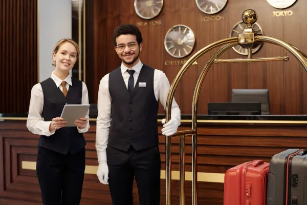 two-young-elegant-employees-of-luxurious-hotel-wai-2026-01-09-08-16-26-utc-696a060f850a4