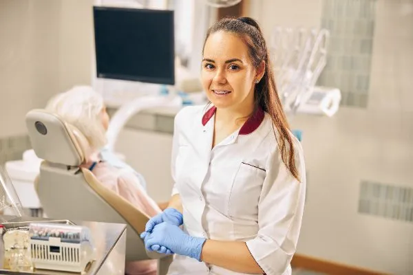 charming-european-dentist-in-blue-gloves-sitting-i-2024-10-18-17-41-30-utc1-68230f1826f1c