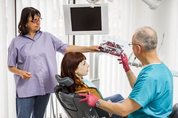 medical-dentist-team-in-dental-office-talking-with-2024-12-12-23-23-22-utc-682301626006f