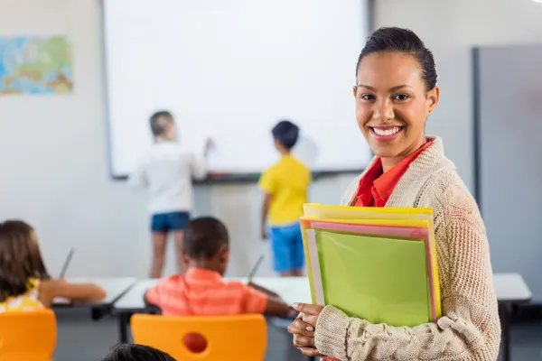 a-teacher-smiling-at-camera-in-classroom-2025-10-28-21-57-23-utc-6931950c28292