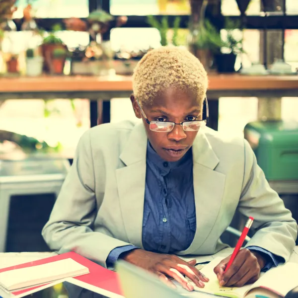 african-businesswoman-writing-paperwork-planning-s-2025-02-09-22-57-37-utc-69319057dd504