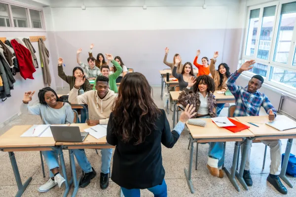 university-students-raising-hands-in-classroom-dur-2025-05-03-08-26-47-utc-6931902edd202