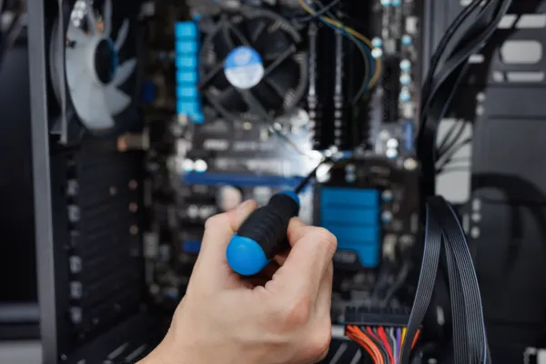 closeup-computer-technician-holding-a-screwdriver-2026-01-07-05-42-41-utc-69df88c0e2df0